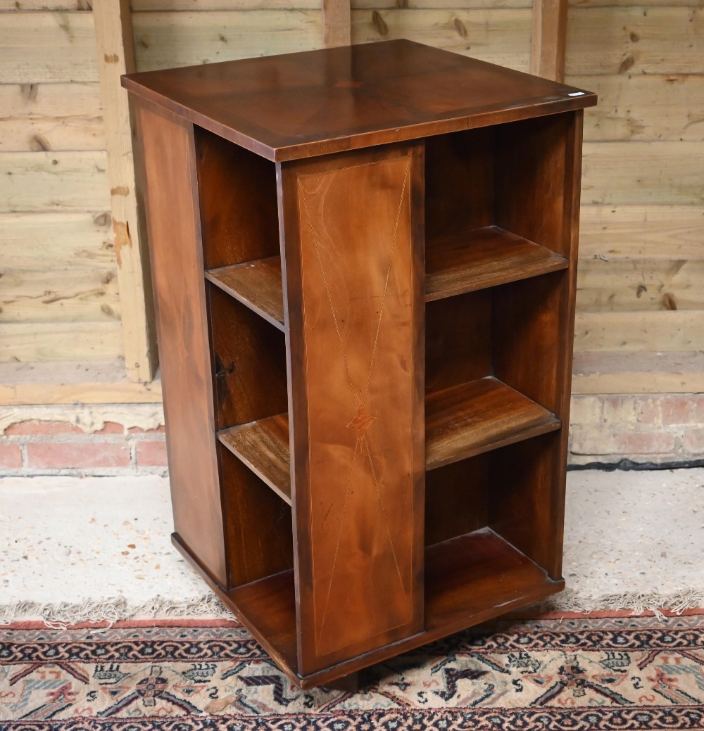 A reproduction mahogany veneered revolving bookcase, 51 cm x 51 cm x 94 cm h