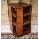 A reproduction mahogany veneered revolving bookcase, 51 cm x 51 cm x 94 cm h