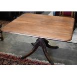 A 19th century mahogany dining table, moulded edge square top on turned column and quad supports,
