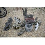 An assortment of weathered garden statuary including a fox, bust, squirrel, well head etc (11)