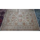 A contemporary Indian Agra carpet, the yelllow/ochre ground with muted floral design, 204 cm x 154