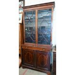 A 19th century mahogany inlaid cabinet bookcase with astragal glazed doors over shallow drawer and