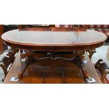 Reproduction flame mahogany crossbanded oval coffee table