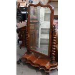 A 19th century mahogany framed cheval mirror with bevelled plate and barley twist supports and