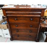 A Victorian mahogany chest with cushion moulded top drawer over four standard drawers between