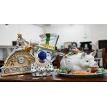 A Capodimonte ceramic clock surmounted by Leda and the Swan, to/w a 'suckling pig' tureen and