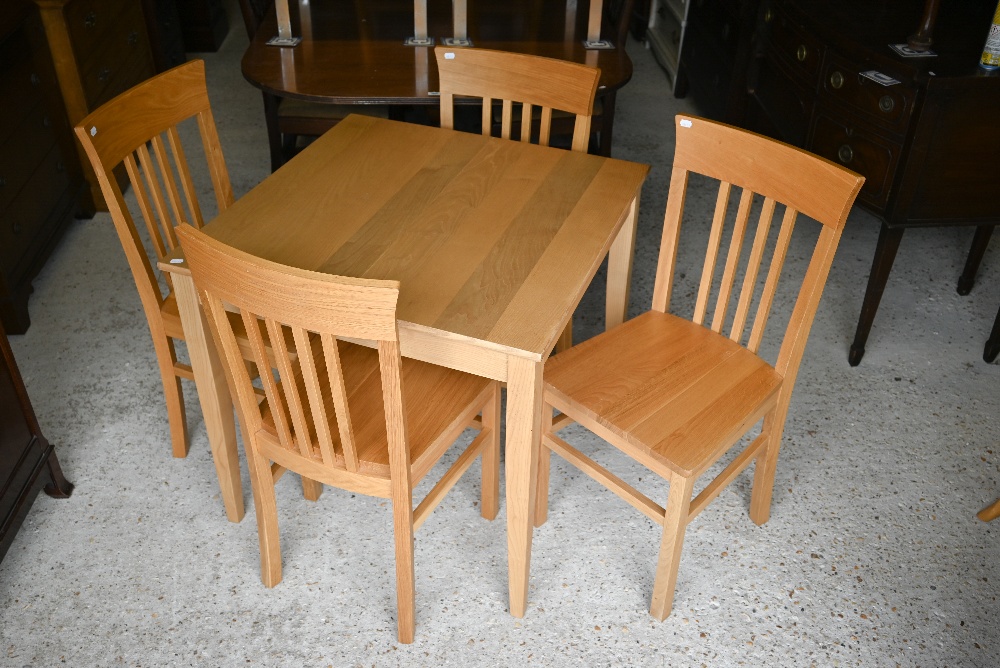 A Lacock oak extending dining table, 80 x 80 x 75 cm (112 cm max) to/w a set of four Lyon oak dining