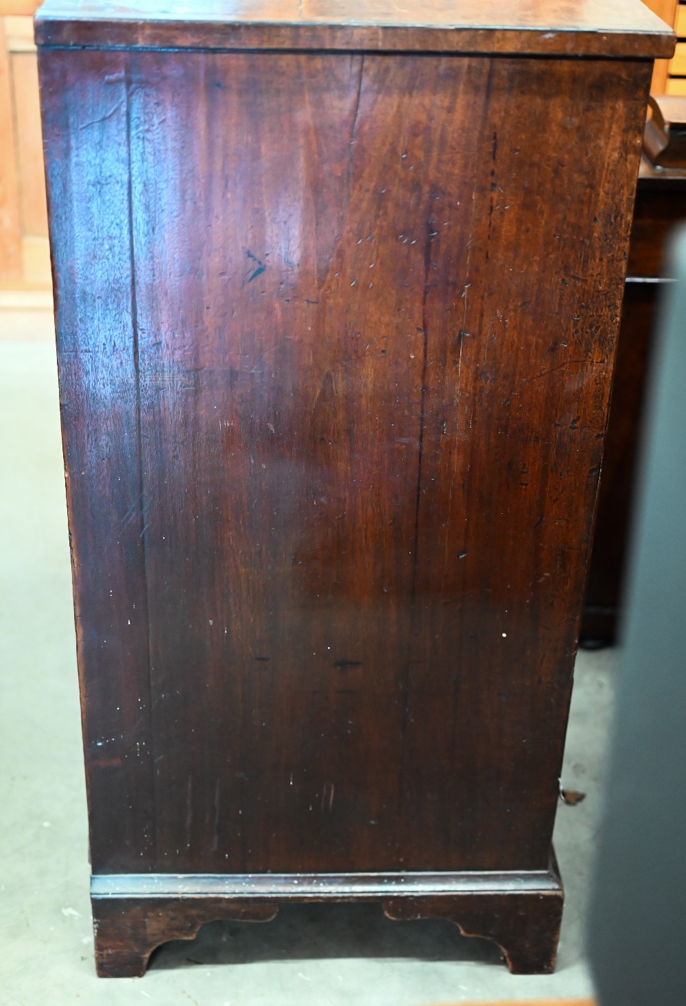 A George III mahogany chest of two short over three long drawers with brass oval handles cast with - Image 8 of 9