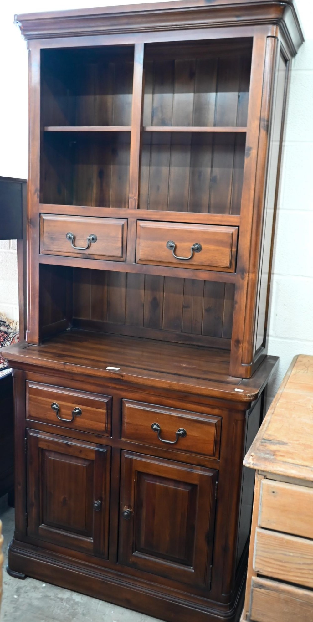 A modern hardwood (Oak Furniture Land, Cranbrook) dresser with four drawers and panelled