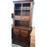 A modern hardwood (Oak Furniture Land, Cranbrook) dresser with four drawers and panelled