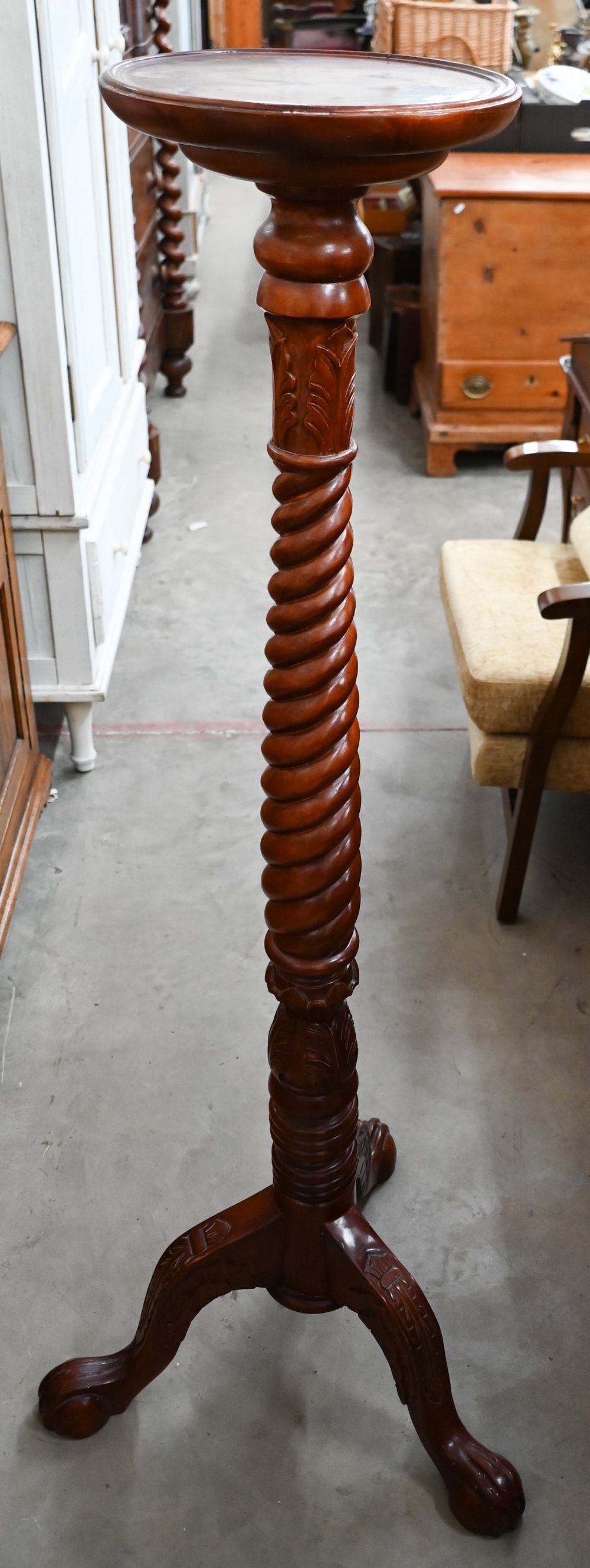 A stained beech barleytwist torchere, 132 cm high