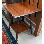 An Edwardian walnut two tier square occasional table in the Liberty manner, 50 cm wide x 50 cm