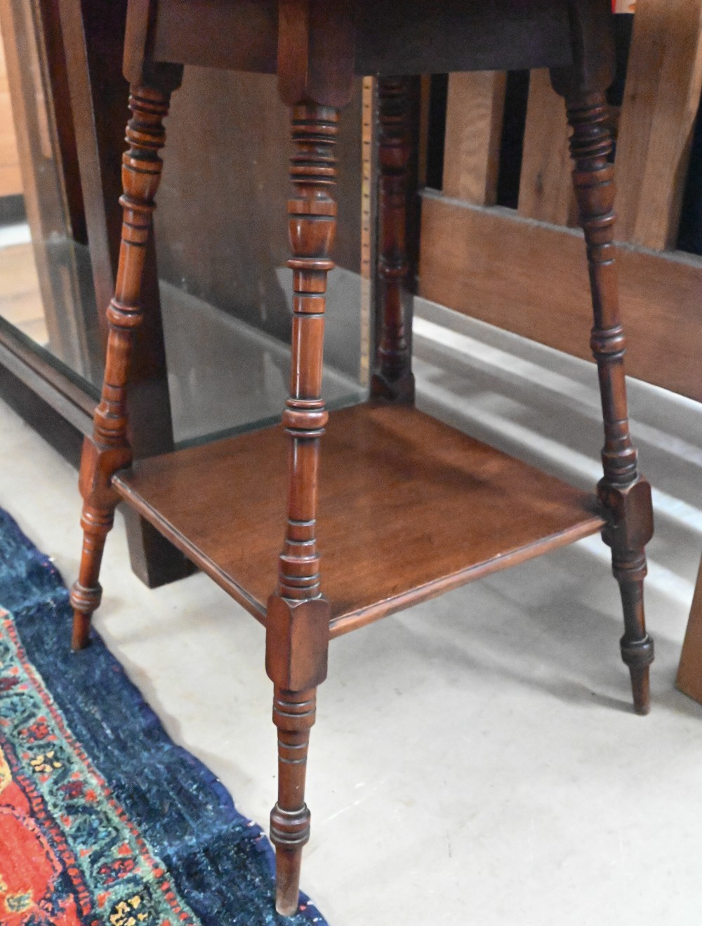 An Edwardian walnut two tier square occasional table in the Liberty manner, 50 cm wide x 50 cm - Image 2 of 2