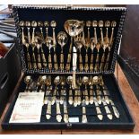 A boxed Italian gold-plated set of flatware and cutlery