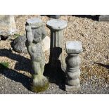 A weathered reconstituted stone cherub pedestal, 66 cm high to/w two other garden pedestal/stands (