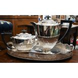 An epns half-fluted tea pot and coffee pot, to/w a galleried oval tray (3)