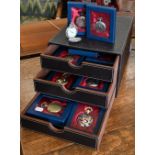 A collection of 29 modern decorative pocket watches with quartz movements (28 boxed), in three-