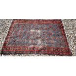 A Persian blue ground rug with Mina-Khani floral design on red borders, 162 x 110 cm