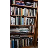 A large collection of books, art, architecture and social history, on six shelves