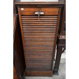 An early 20th century oak tambour front filing chest 'Whitfield King & Co, Ipswich' plaque, c/w key,