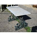 A garden table with white marble top on naturalistic cast iron base stamped 'registered design', 133