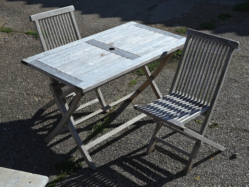 Rectangular teak garden dining table on folding base, 120 x 70 x 75 cm high to/w pair of teak chairs