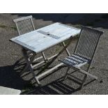 Rectangular teak garden dining table on folding base, 120 x 70 x 75 cm high to/w pair of teak chairs