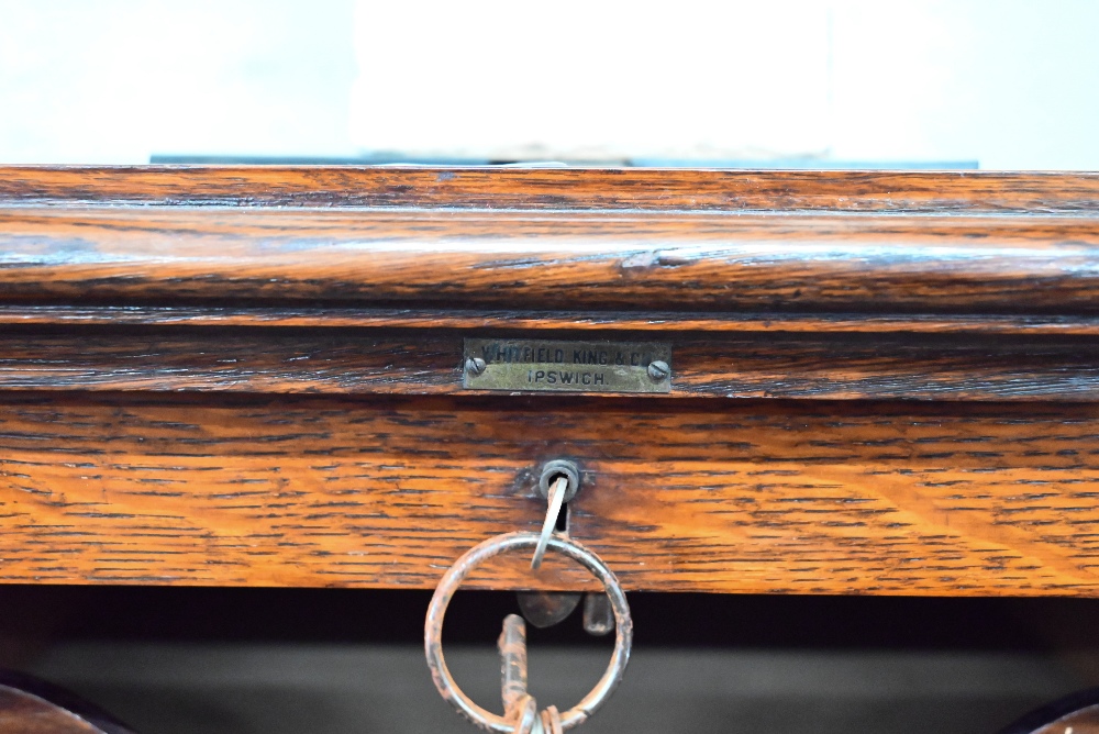 An early 20th century oak tambour front filing chest 'Whitfield King & Co, Ipswich' plaque, c/w key, - Image 4 of 4