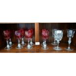 A set of eight cranberry flash cut wine glasses, to/w a heavy quality pair of cut wine glasses and