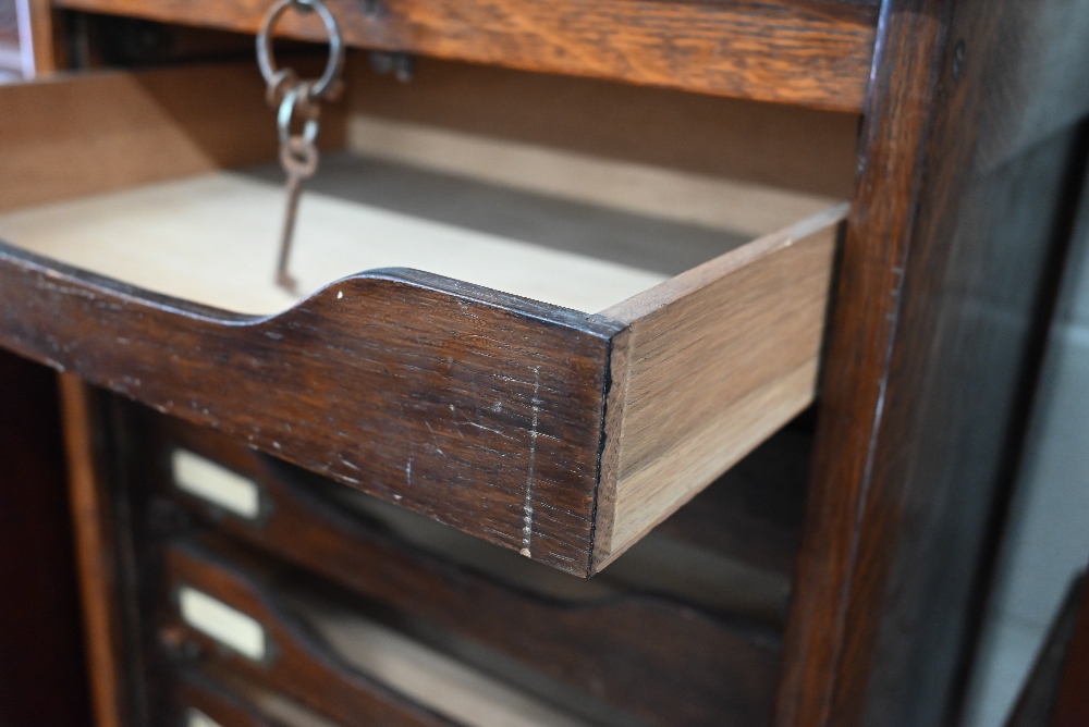 An early 20th century oak tambour front filing chest 'Whitfield King & Co, Ipswich' plaque, c/w key, - Image 3 of 4