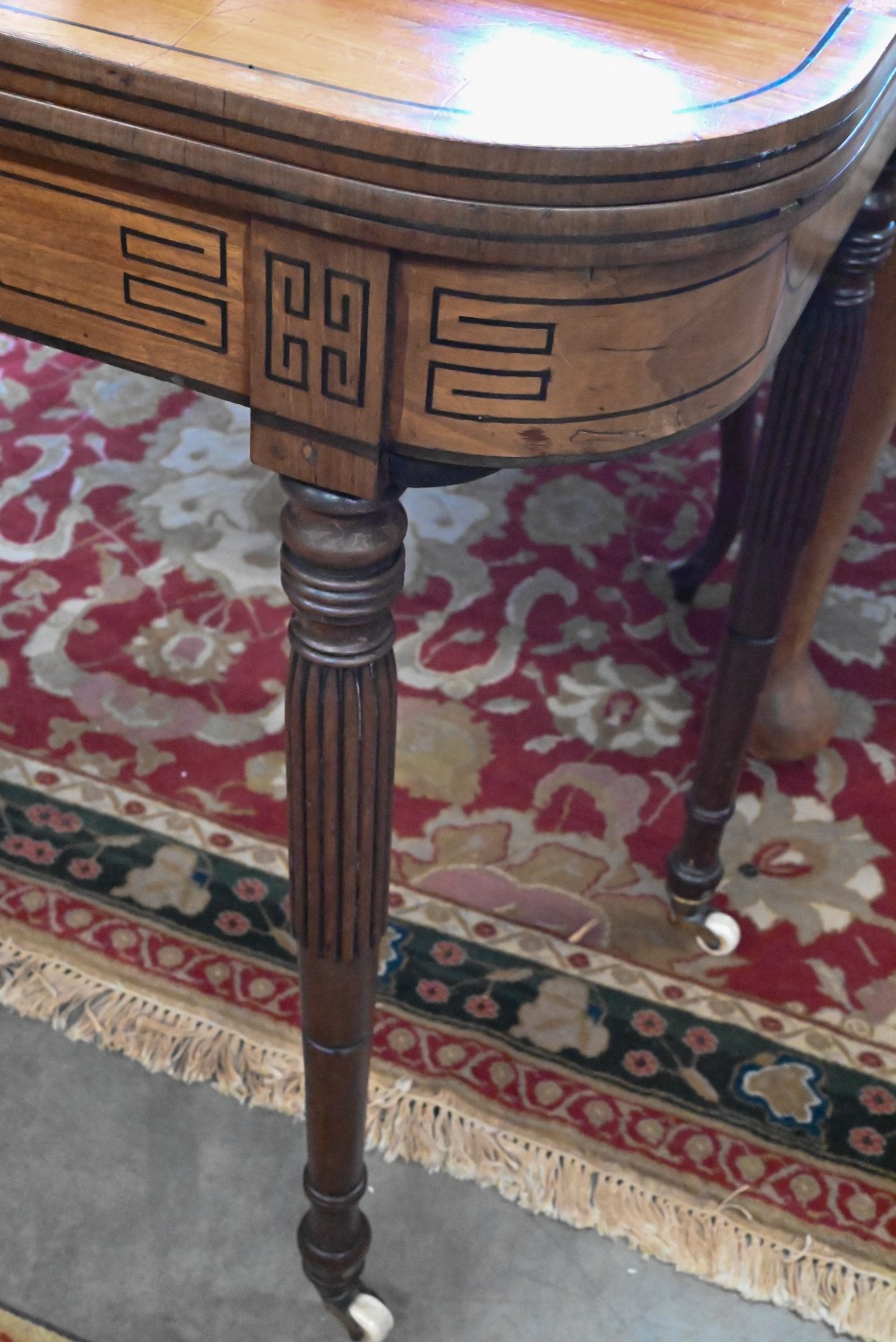 A 19th century mahogany and ebony strung card table with folding baize lined top on turned and - Image 2 of 4