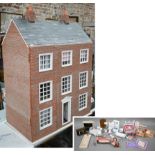 A three storey doll's house and accessories