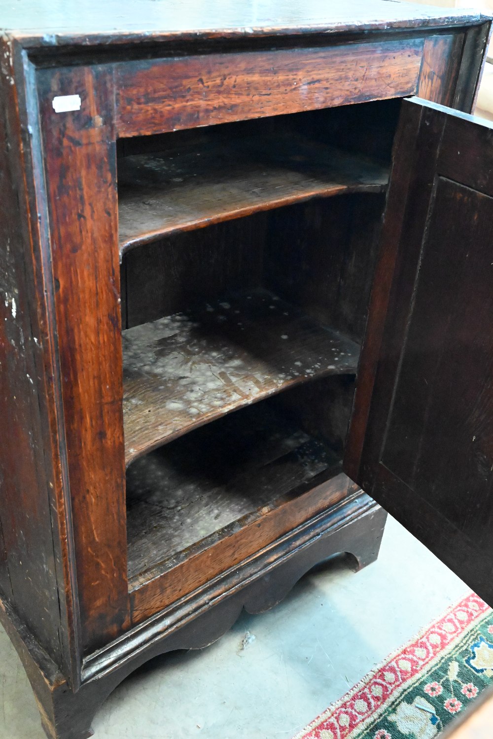 An antique Provincial oak side cabinet on stand with single panelled door enclosing shelves, 60 x 35 - Image 2 of 3