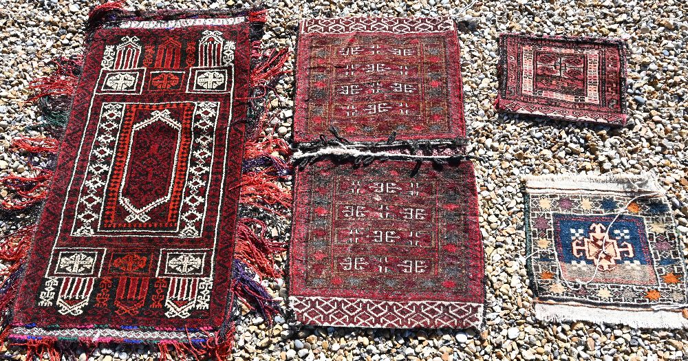 A Persian Turkoman saddle bag, Turkoman carpet bag, large Balouch carpet bag and a Turkish small