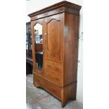 An Edwardian walnut and satin banded compactum wardrobe, 130 cm wide x 50 cm deep x 204 cm high