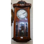 C Wood & Son - A Vienna-style wall clock with 15 day movement, c/w pendulum and key, 78 cm high