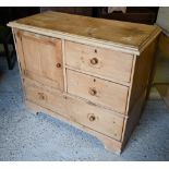 A vintage pine chest with panelled cupboard and three drawers on bracket fee, 96 x 45 x 82 cm high