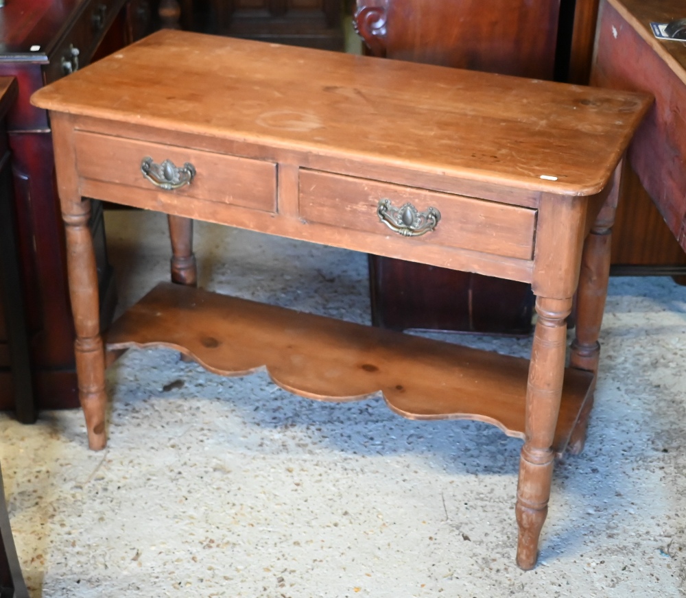 An early 20th century waxed pine hall table with two drawers on turned supports united by undertier, - Image 2 of 4