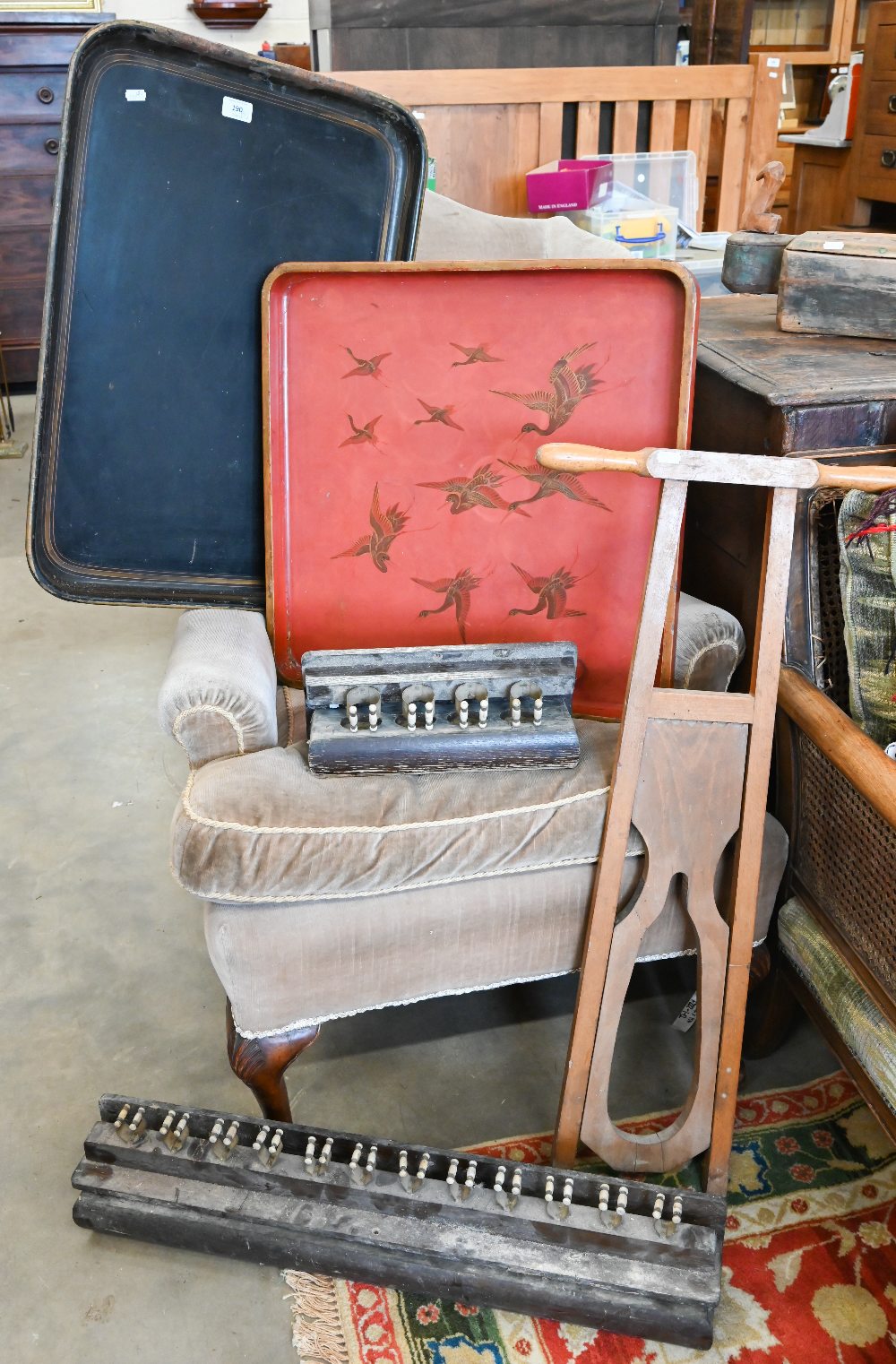 A vintage folding boot-jack, Japanese red lacquer tray gilded with cranes , signed, a 19th century