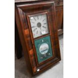 A 19th century Jermome & Co American wall clock with mahogany ogee case, the glass panel painted