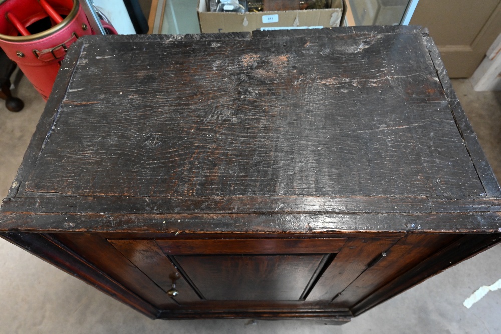 An antique Provincial oak side cabinet on stand with single panelled door enclosing shelves, 60 x 35 - Image 3 of 3