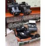 Three Polaroid cameras, a Cosina CS-1 SLR body and a tripod
