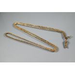 A 9ct yellow gold fancy link guard chain with tassel fob and watch key attached, approx 47.9g all in