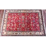 A contemporary North West Persian Tabriz rug, the red ground with flowering vine design, 205 cm x