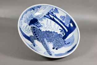 A Chinese transitional style blue and white charger in the mid 17th century manner, painted in