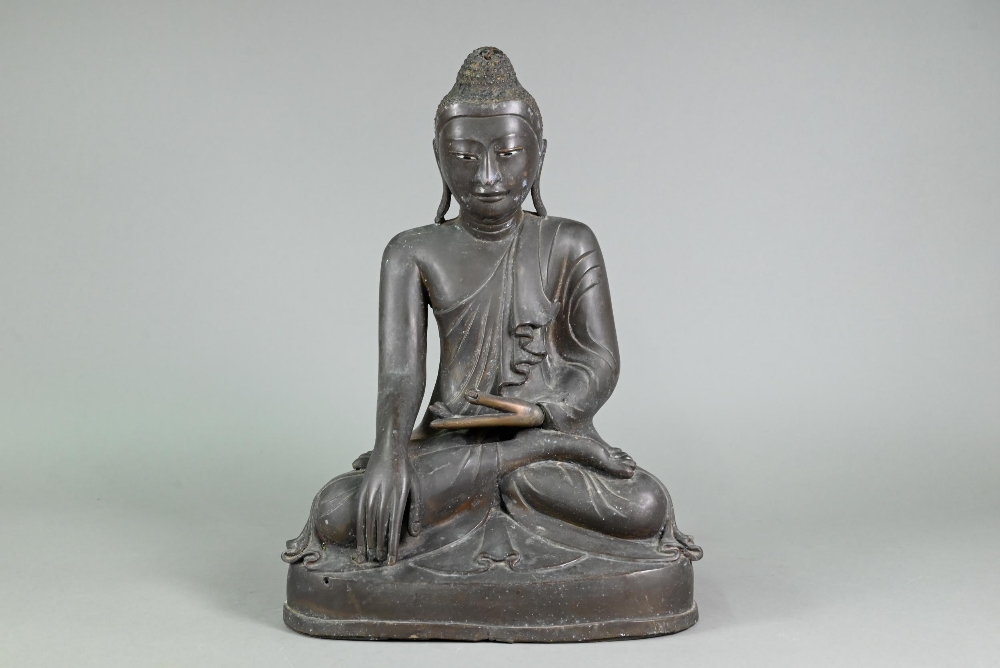 A large 19th century Burmese Mandalay style bronze Shakyamuni Buddha, seated in the lotus position