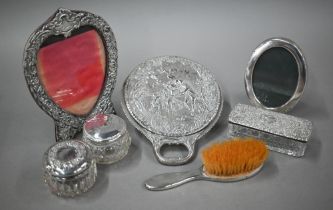 A late Victorian silver hand-mirror, London 1899, to/w a heart-shaped easel photograph frame,