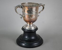 A Georgian unmarked silver loving cup with twin scroll handles, on stemmed foot, makers mark only WT