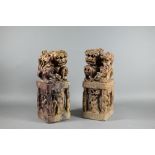 A pair of Chinese carved soapstone block seals, surmounted by Kylin, 21 cm