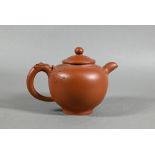 A vintage Chinese Yixing teapot and cover with relief moulded prunus decoration, circa 1970, seal